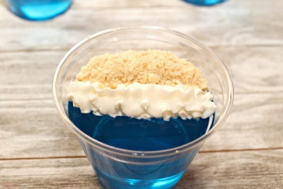 Day at the Beach Jello Cups are perfect for a summer party. The best part is once everyone is done eating the yummy treat, you can just throw away the dishes! Try them for your next luau or pool party.