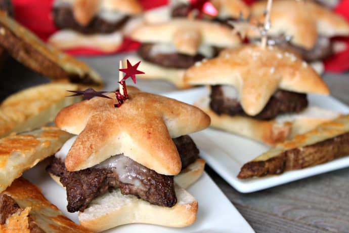 cooked star Sliders on plates with potato wedges and red accents 