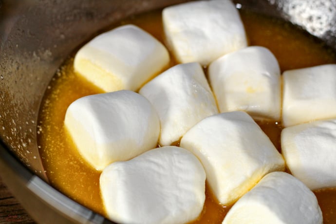 bowl of melted butter and whole marshmallows