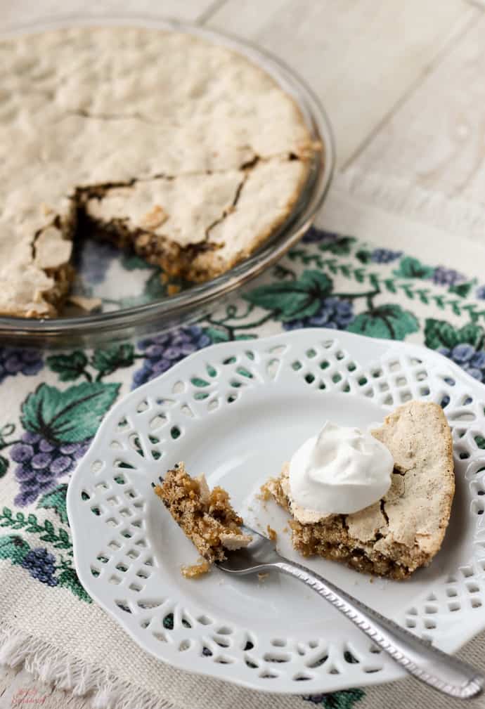 whole pie with slice cut out; slice on a white plate