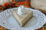 You're going to love this smooth and creamy Crockpot Express Pumpkin Cheesecake! It's made with a spicy gingersnap crust and is bursting with fall flavors!