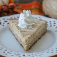 You're going to love this smooth and creamy Crockpot Express Pumpkin Cheesecake! It's made with a spicy gingersnap crust and is bursting with fall flavors!