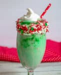 This delightful cheesecake milkshake resembles and elf with green, red, and capped with a whipped topping hat. Go crazy with one big glass, or divided your Elf Shake into smaller glasses for the family!