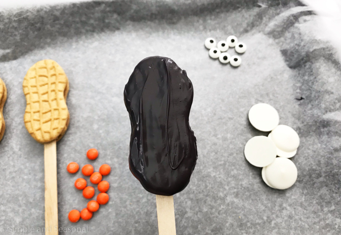 cookie pop dipped in black melting candy