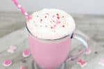 Celebrate Valentine's Day (or any cold winter day) with this creamy and delicious Pink Hot Chocolate. It takes strawberry milk up a notch!