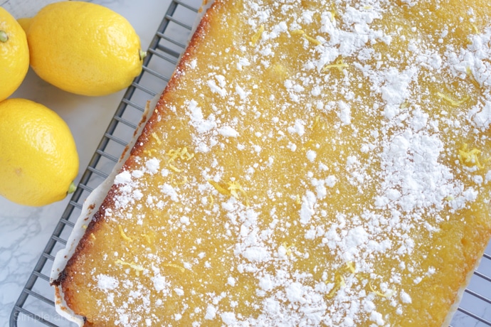 cooked lemon bar mixture sprinkled with powdered sugar
