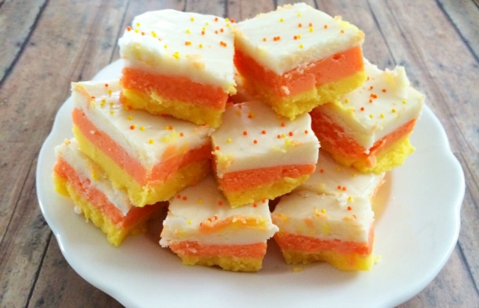 candy corn fudge squares, layers of yellow, orange and white with sprinkles