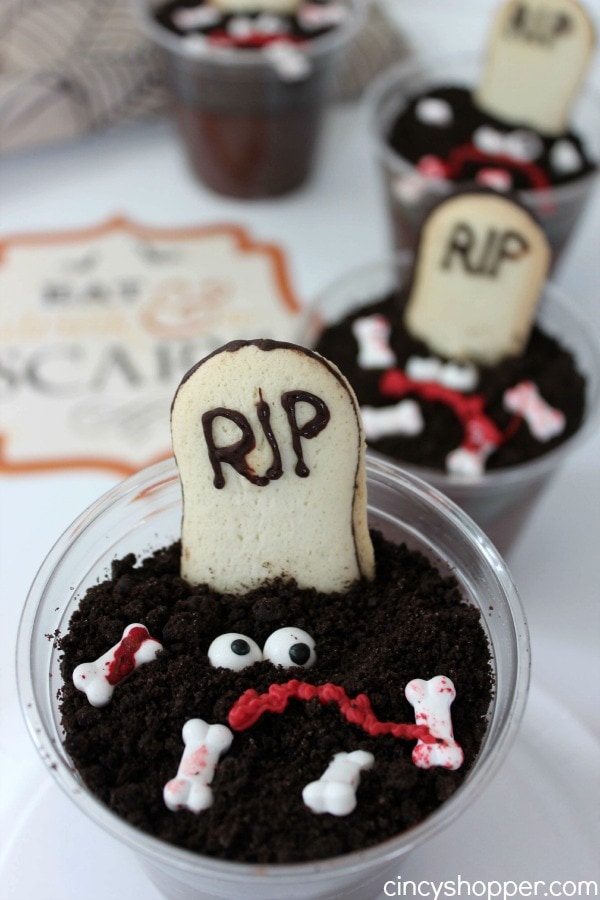 pudding cup covered with oreo dirt and graveyard marker made from cookies