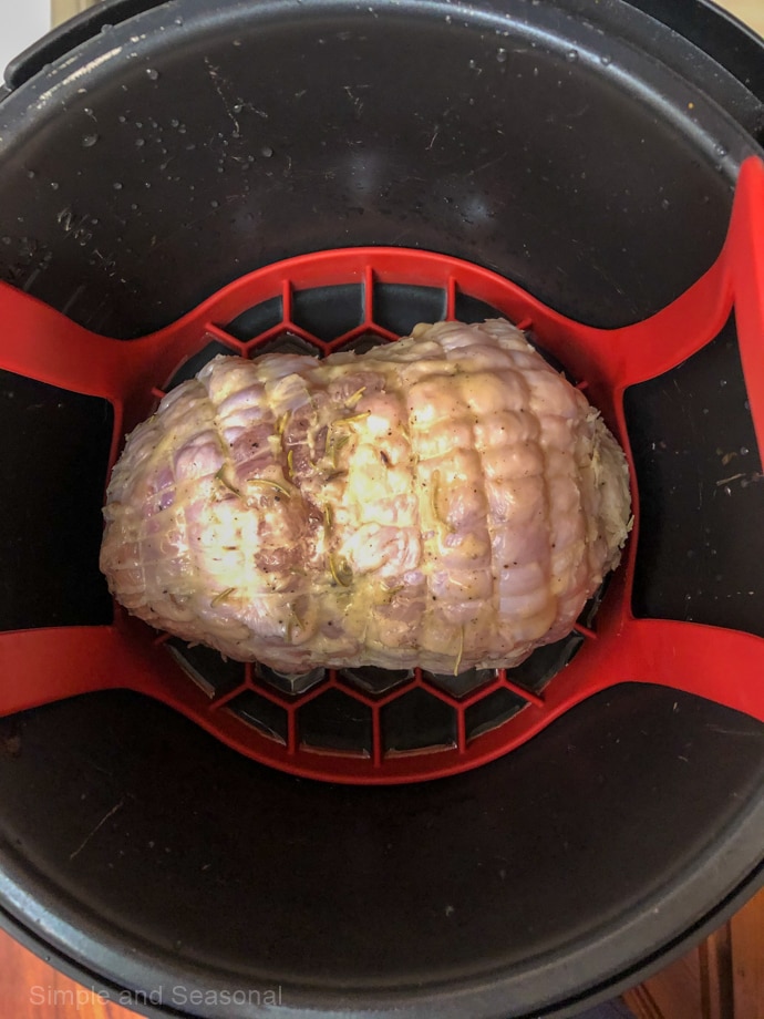 raw turkey breast inside pot of pressure cooker