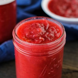 jar filled to the top with cranberry applesauce