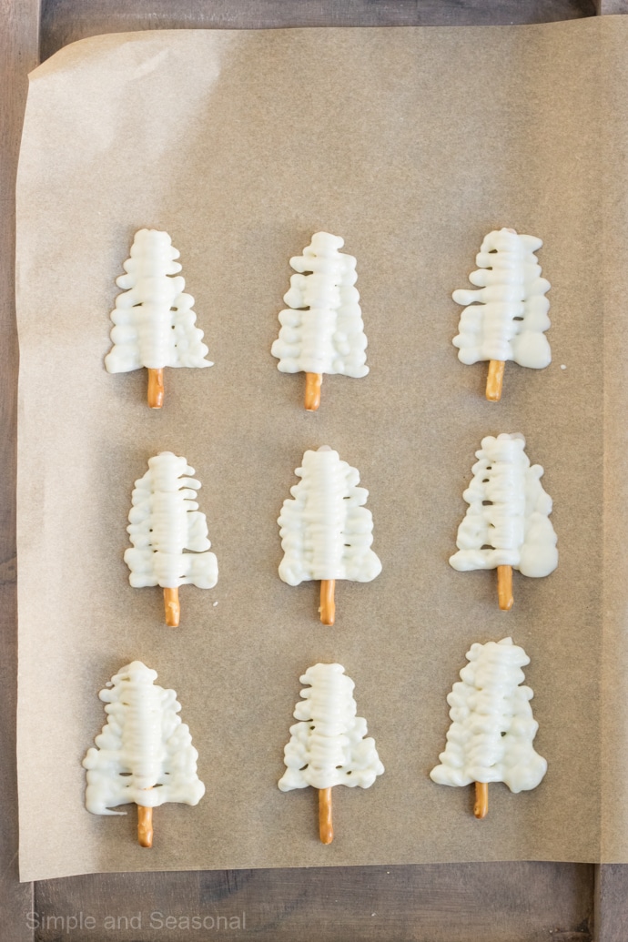 candy melt piped over pretzel sticks to resemble trees