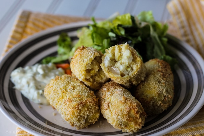 plate of cooked fish sticks and salad