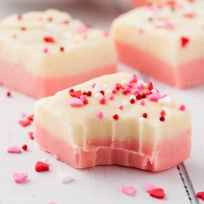 piece of white and pink fudge with bite taken out of it