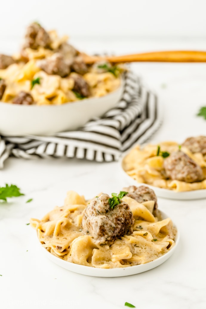 plate of swedish meatballs with large bowl in the background