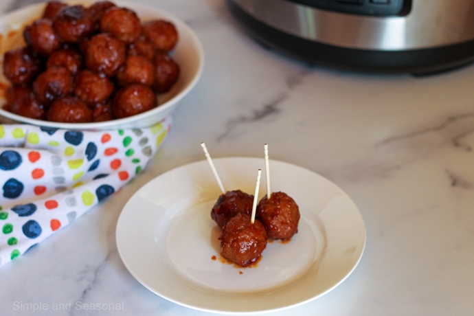 3 meatballs on a white plate