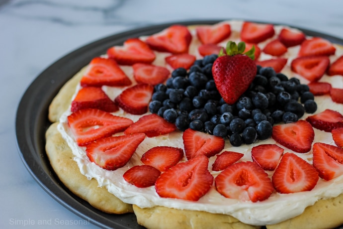 strawberries and blueberries on a rhodes roll crust