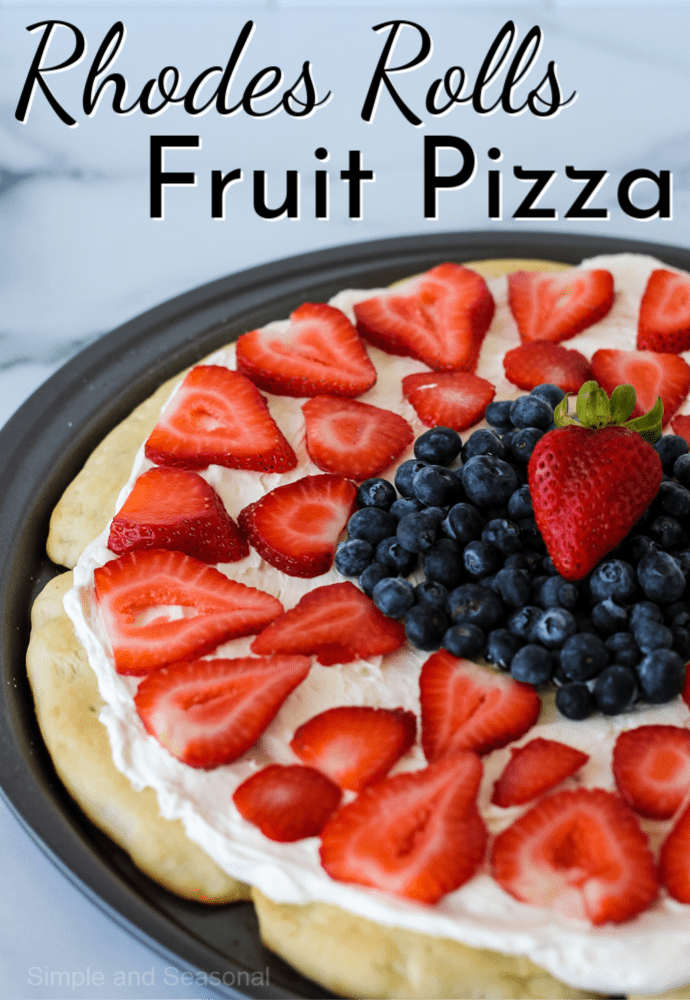 whole fruit pizza in the pizza pan with a label that reads: rhodes rolls fruit pizza