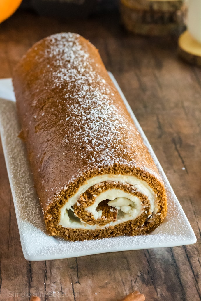 pumpkin roll dusted with powdered sugar