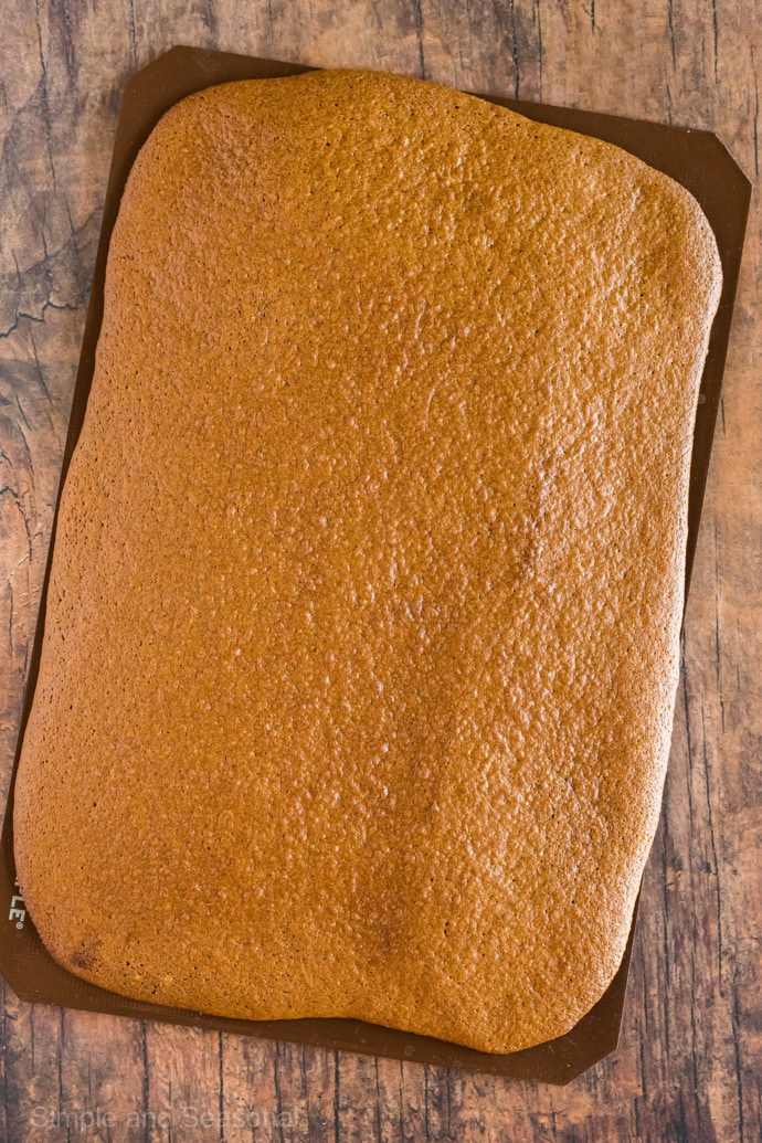 cooked pumpkin roll sheet on silicone mat