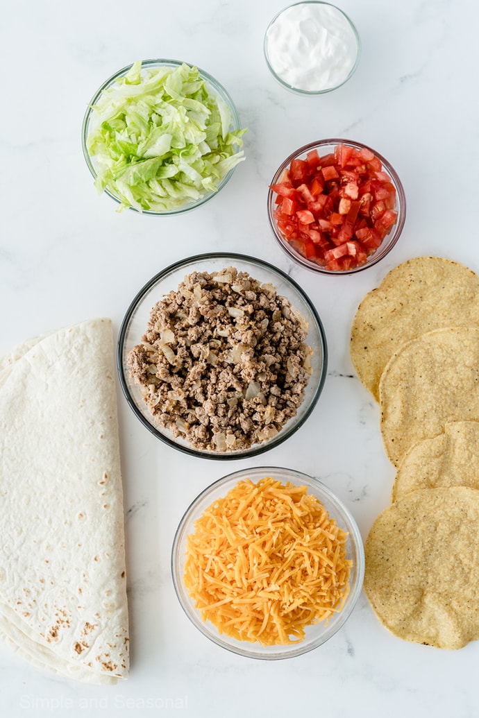 ingredients: ground beef, cheese, lettuce, tomatoes, flour and corn tortillas