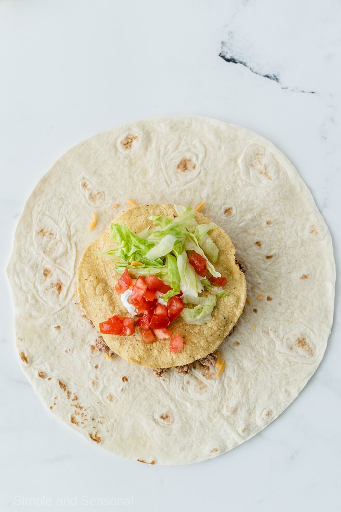 lettuce and tomato on tostada shell