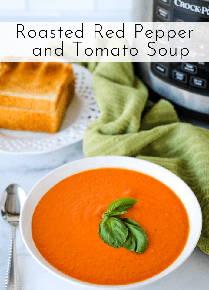 red soup in a white bowl with a green basil leaf on top: text label reads Roasted Red Pepper and Tomato Soup