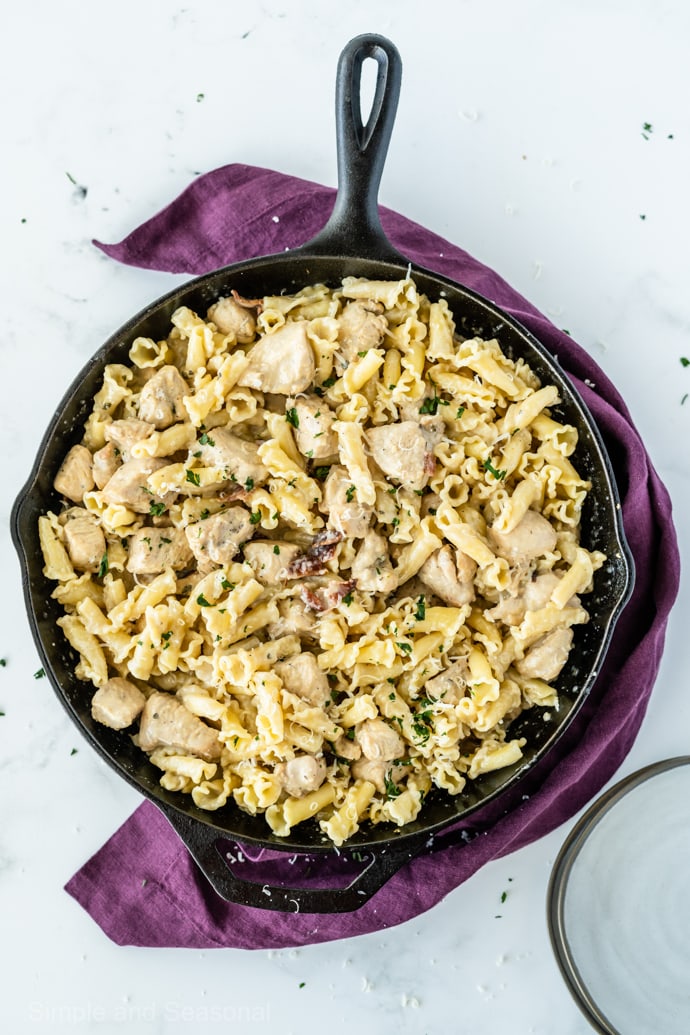 cooked pasta in skillet with meat and sauce