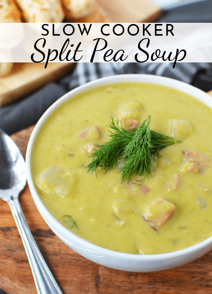 bowl of split pea soup on wooden platter with breadsticks
