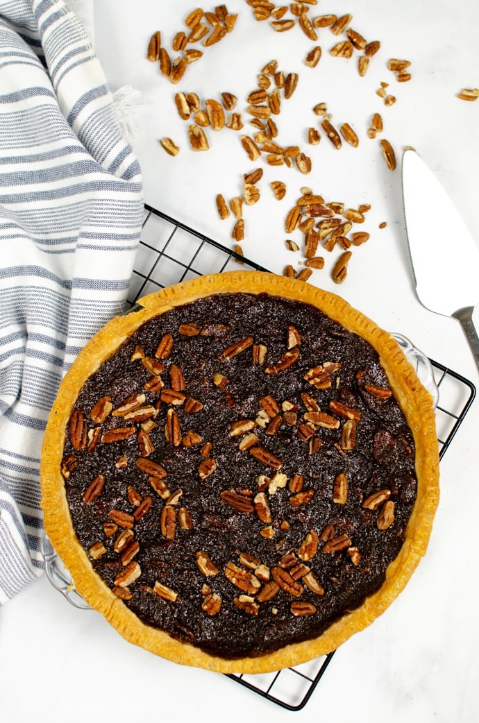 baked chocolate pecan pie on a cooling rack