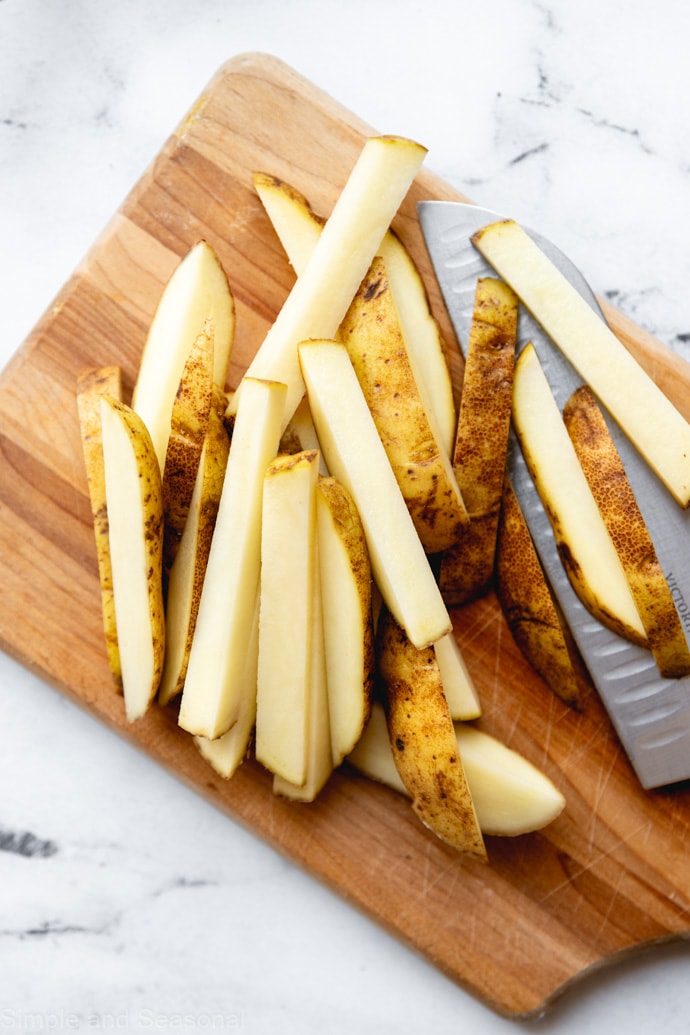 cut potato sticks on a cutting board