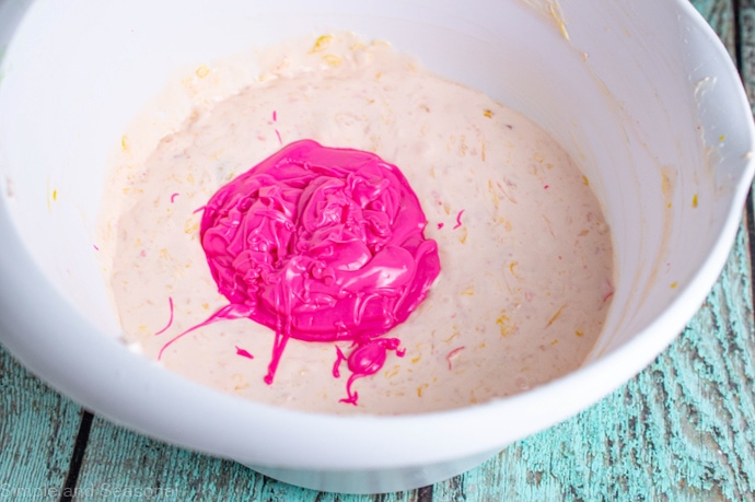 bright pink candy melts added to cheesecake mixture