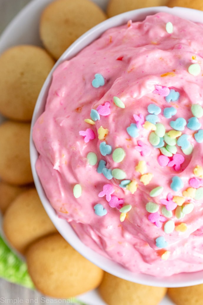 top down view of pink cheesecake dip with Easter sprinkles