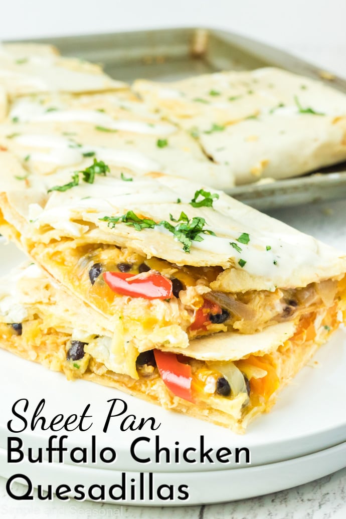 cut quesadillas on a plate with sheet pan in the background