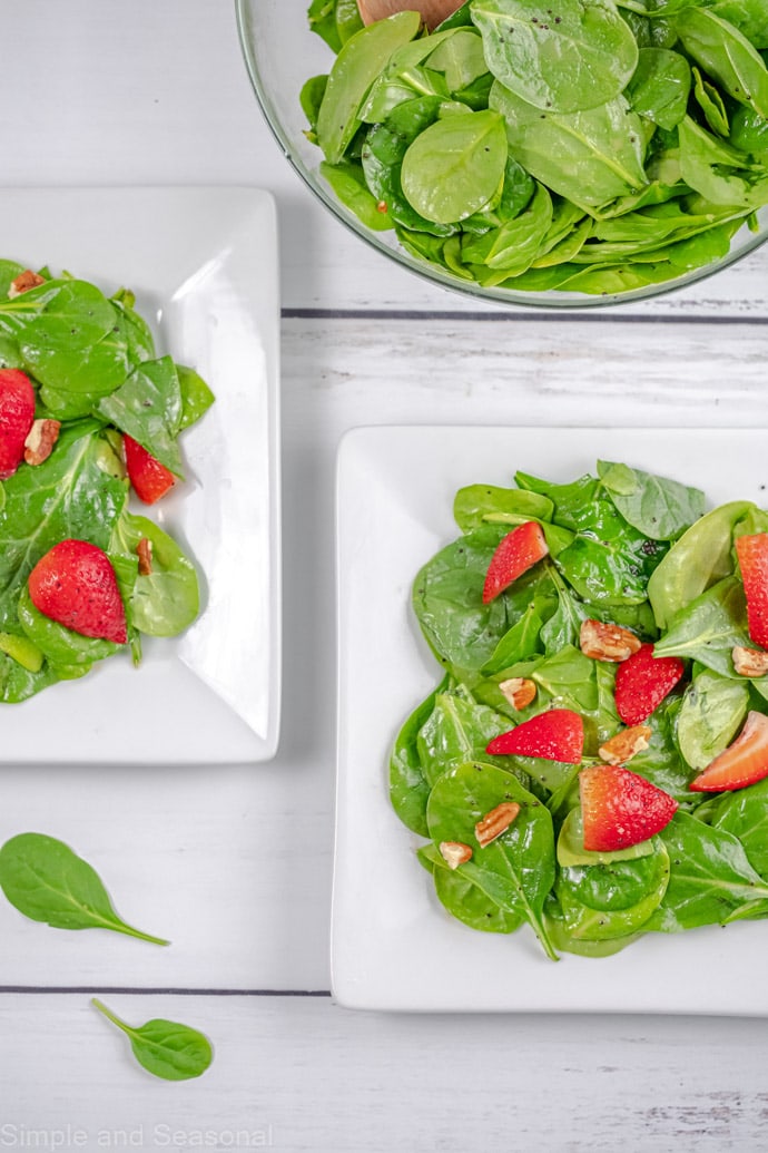 top down view of two plates of salad