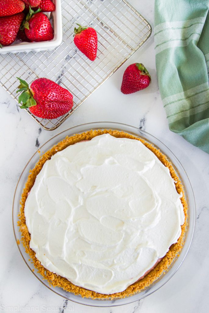 whipped cream topping on strawberry mousse pie