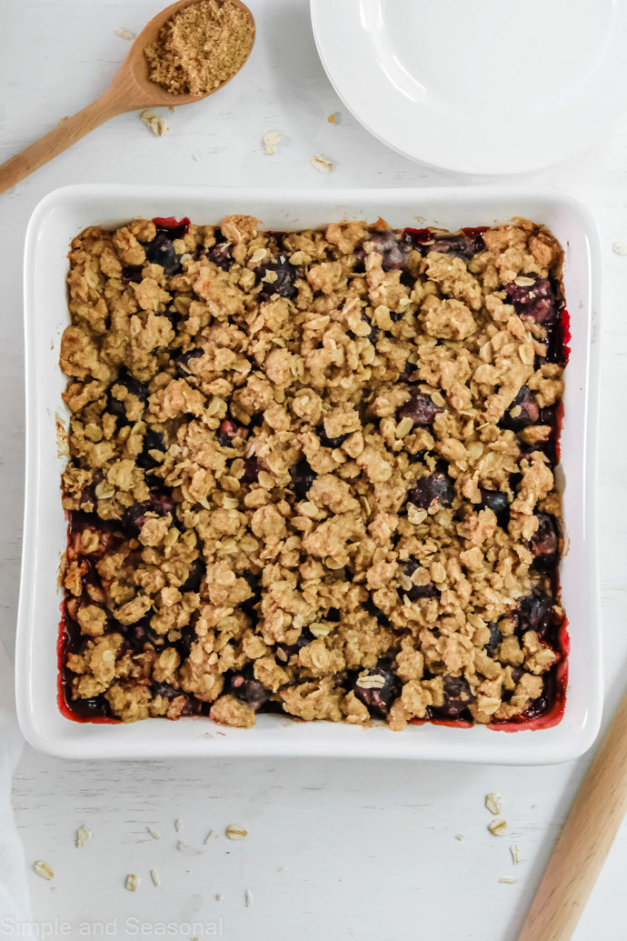 baked cherry crumble in a white square pan