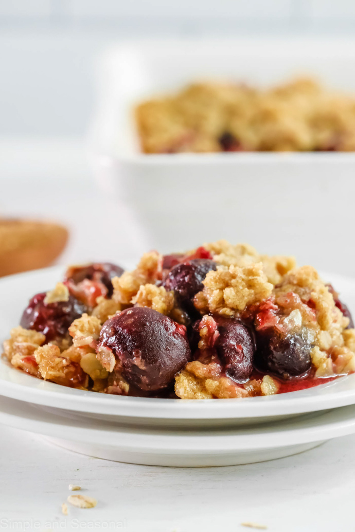 plate of cherry crumble without ice cream on top