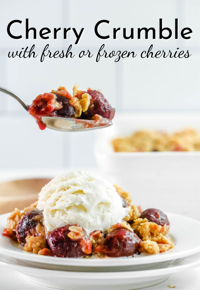 plate of cherry crumble with vanilla ice cream on top and spoonful of cherries; text label reads Cherry Crumble with fresh or frozen cherries