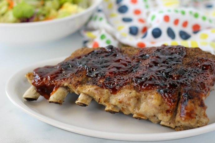 cooked ribs on a white plate