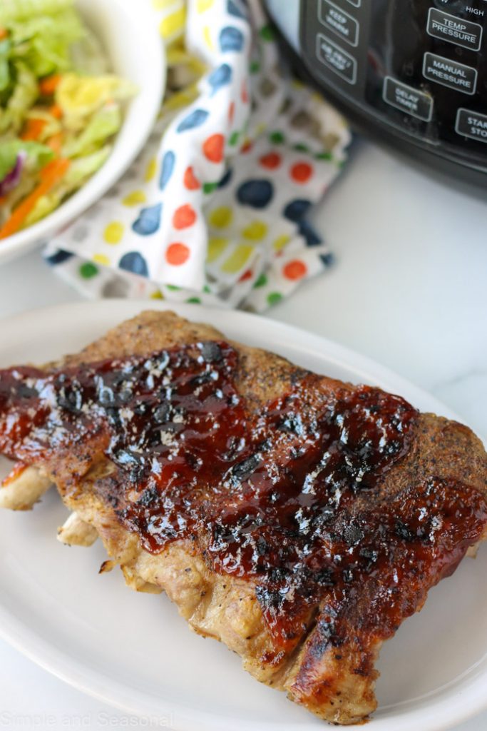 top down view of crockpot express ribs cooked on a plate