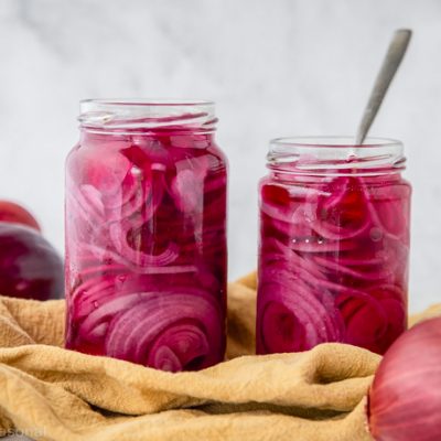 pickled red onions in two jars