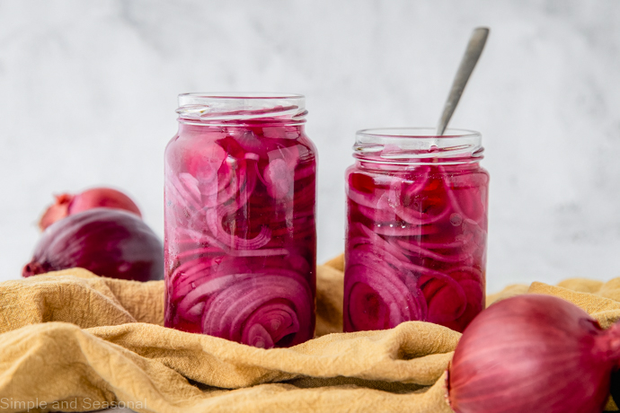 pickled red onions in two jars