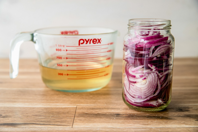 glass jar stuffed with onion slices