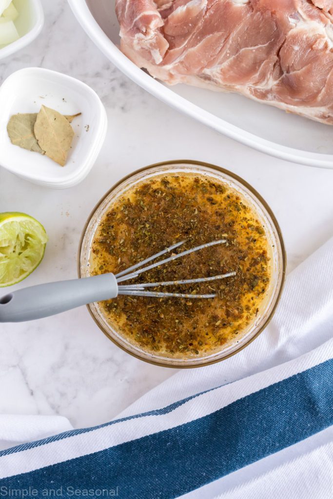 mixing bowl with juices and seasoning for Cuban pulled pork