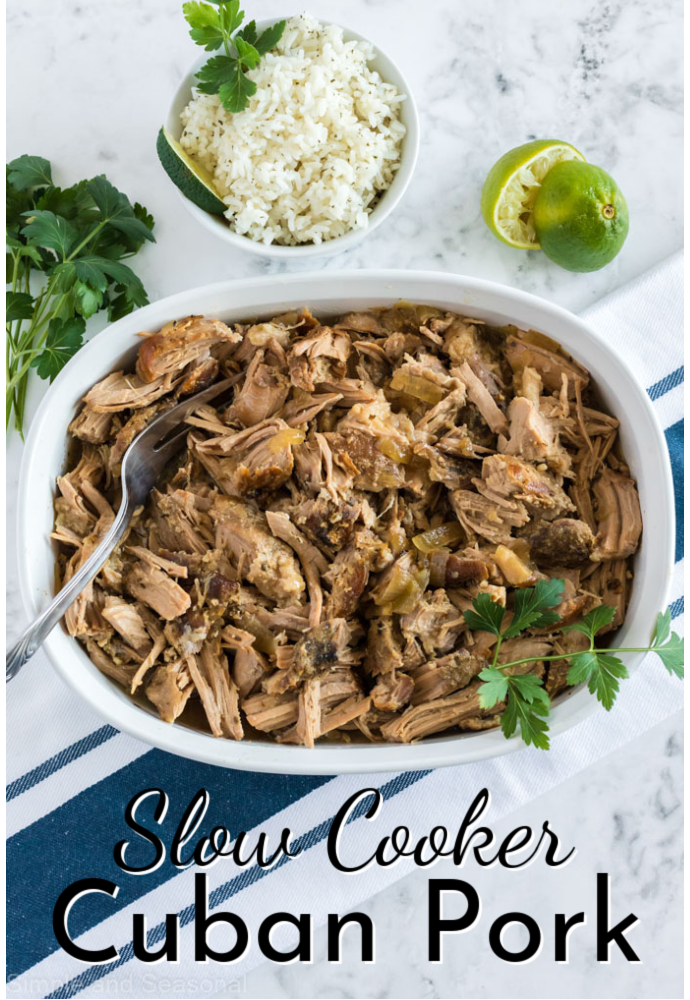shredded pork in a white serving dish on blue striped towel; text label reads: Slow Cooker Cuban Pork