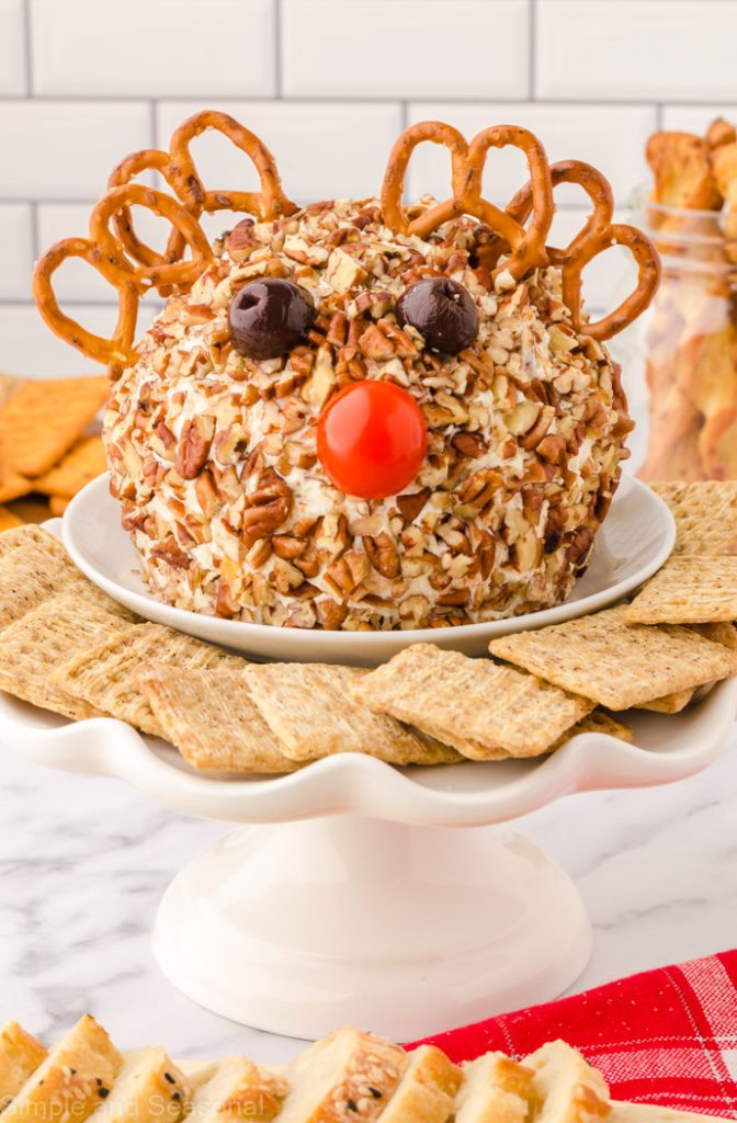 rudolph cheese ball on a platter with crackers