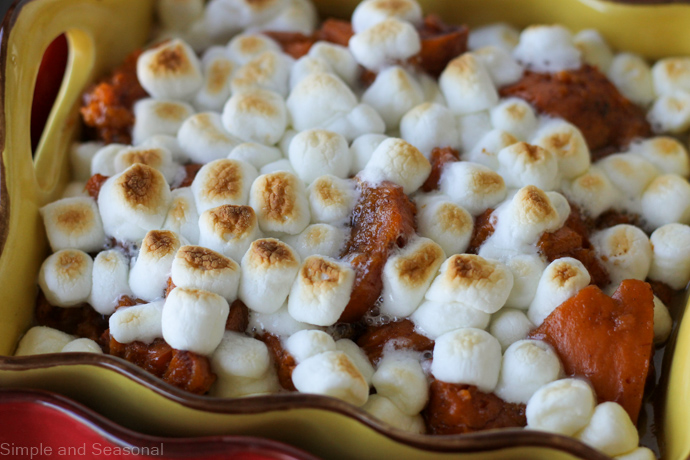 close up of cooked candied yams topped with marshmallows