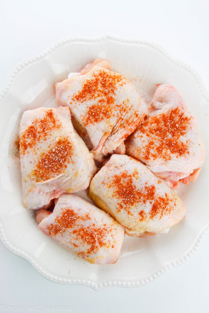 chicken thighs sprinkled with cayenne pepper
