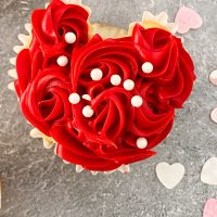 heart cupcake with mini rosettes piped on frosting