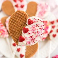 heart shaped waffle pop with red candy hearts and pink sprinkles
